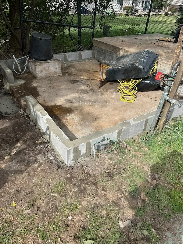 Concrete slab with newly installed block foundation walls