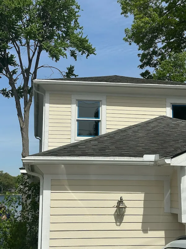 Upper-story replacement window on a sided home